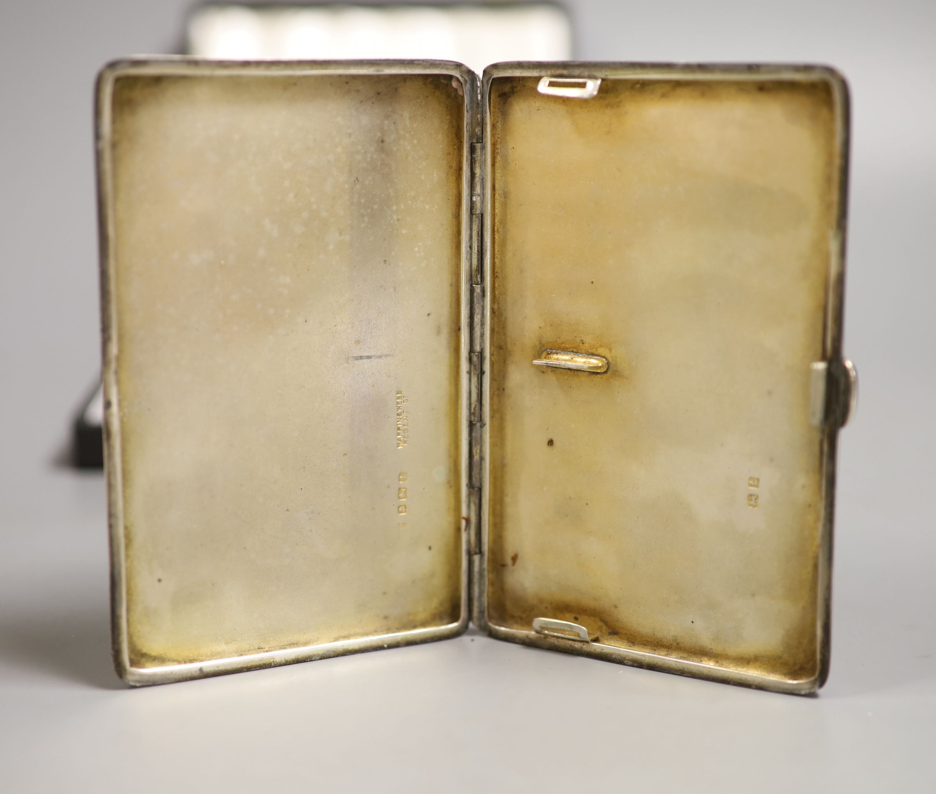 A George V silver cigarette case, 12.7 cm, a 900 standard white metal snuff box and five silver teaspoons..